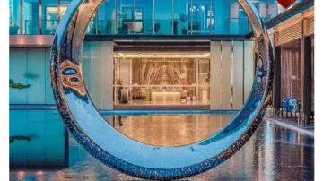 酒店不锈钢圆环雕塑价格镂空椭圆形球景观图